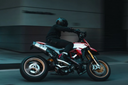 man about to lean motorcycle