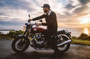 man riding on his motorcycle